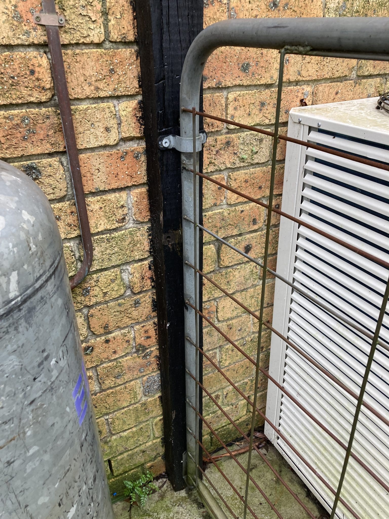 A post embedded in concrete on the house in a home near Lakesland close to Thirlmere